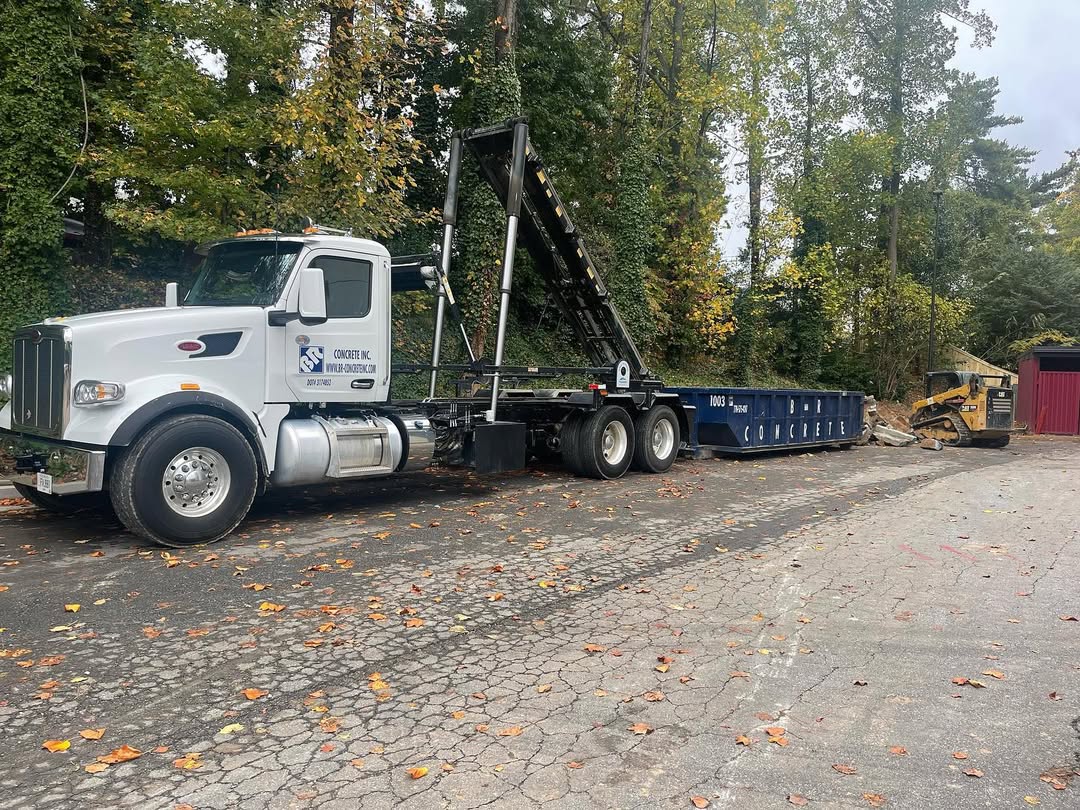 BR Roll Offs dumpster rental truck delivering roll off container in Dunwoody GA
