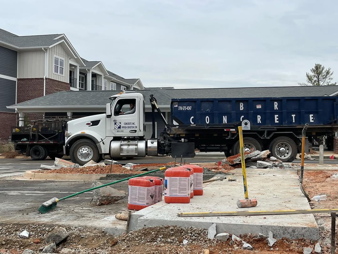 Roll off dumpster loaded on BR Roll Offs truck for delivery in Dunwoody Georgia